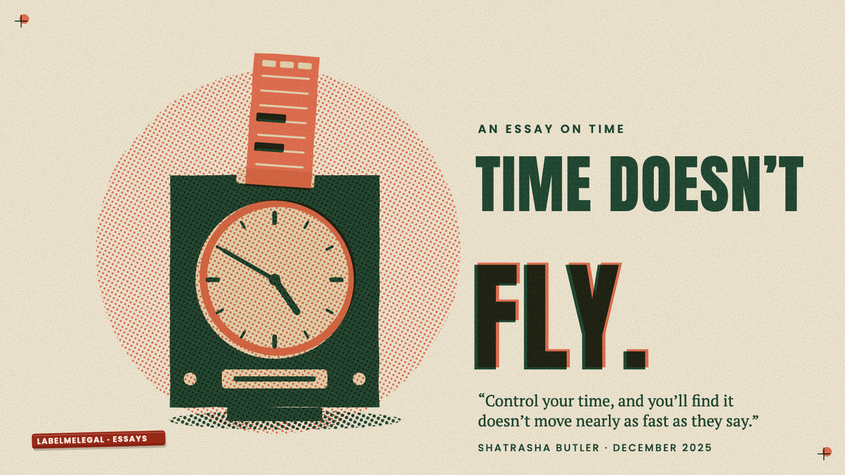 An old factory punch clock with a timecard standing in its slot, printed in two inks beside the words Time doesn’t fly.
