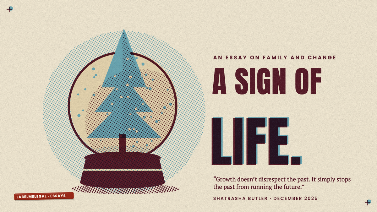 A snow globe whose blue pine tree has grown too tall and pokes out through the top of the glass, printed in two inks beside the words A sign of life.